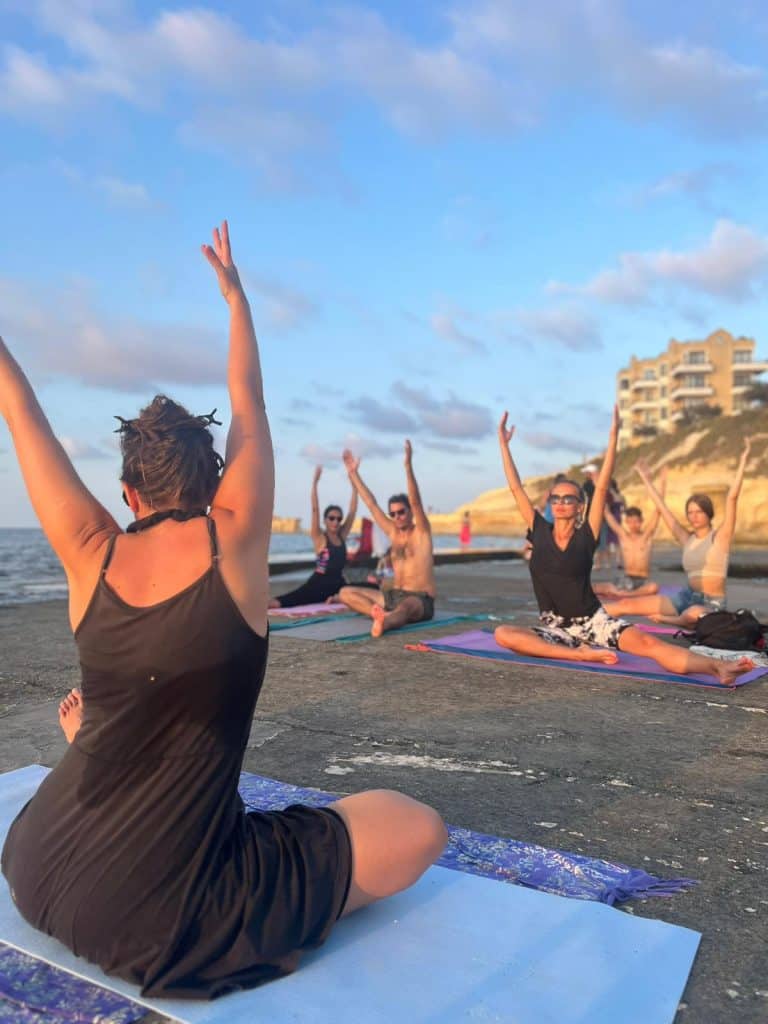 Laura enjoying a Yoga lesson with students